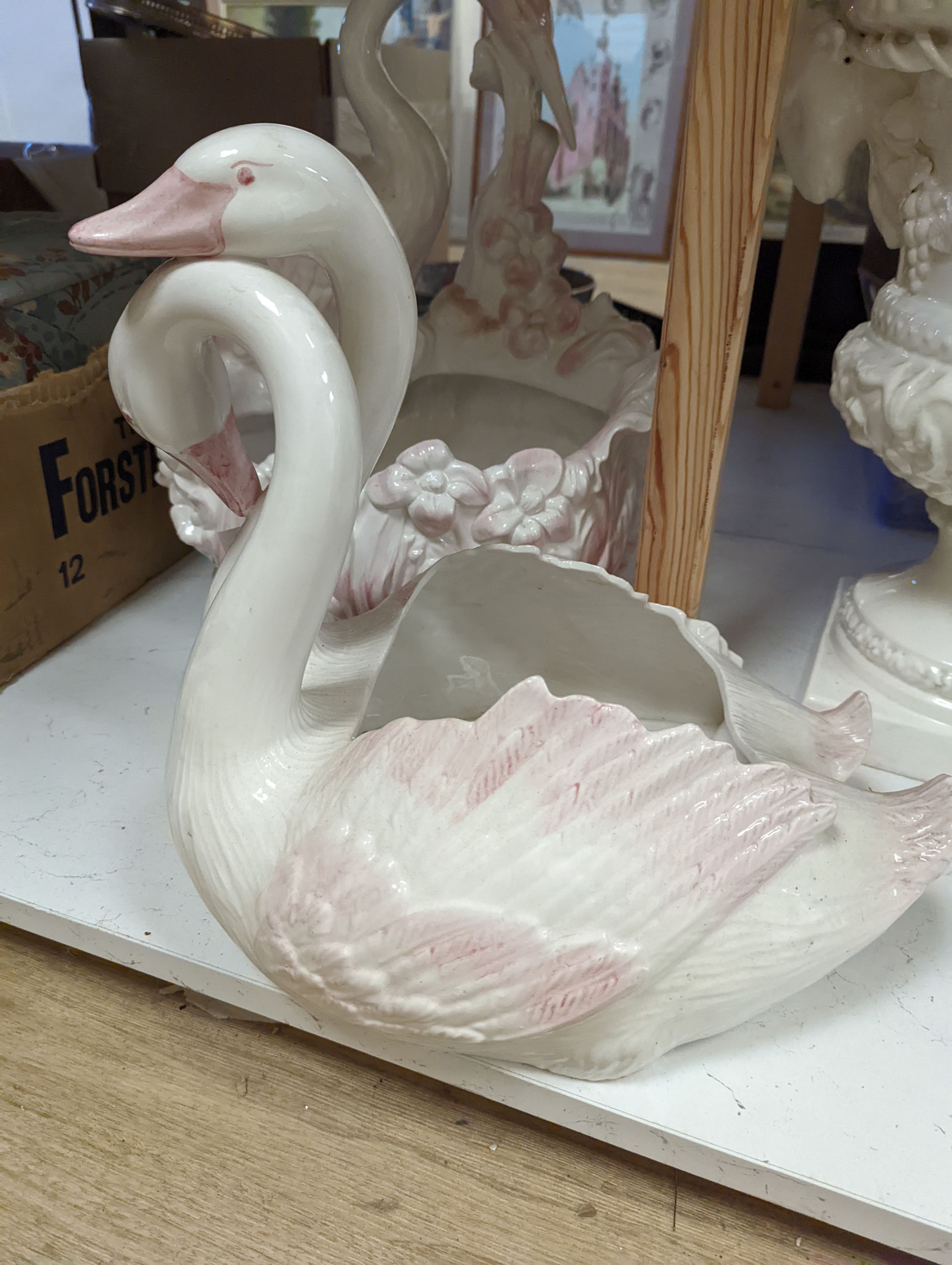 Decorative modern continental pottery, including two jardinières, modelled with swans, a white glazed urn